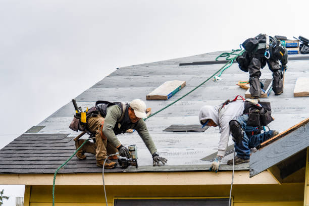 Professional Roofing technician working in Runnells, IA